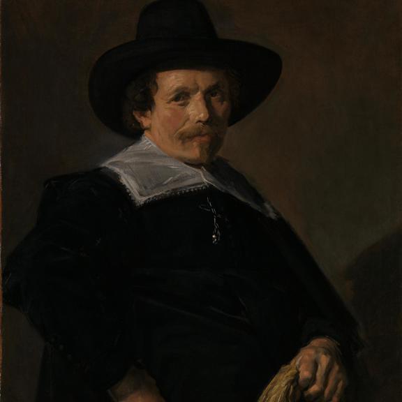 Portrait of a Man holding Gloves