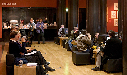 People drinking, talking and using ArtStart in the Espresso Bar