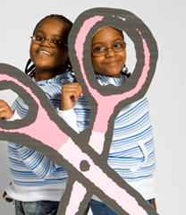 Girls with giant cardboard scissors
