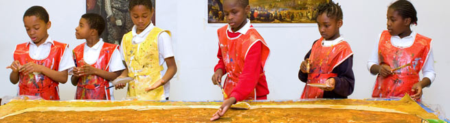 School children creating artwork