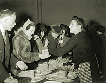 Women serving sandwiches