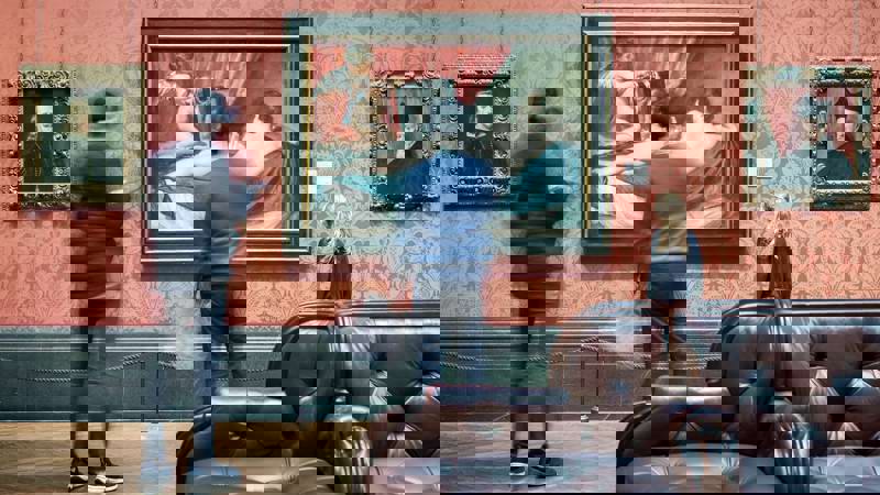 Timelape Blur Of People In Front Of Painting In Gallery