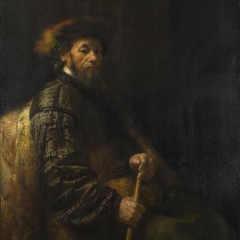A Seated Man with a Stick