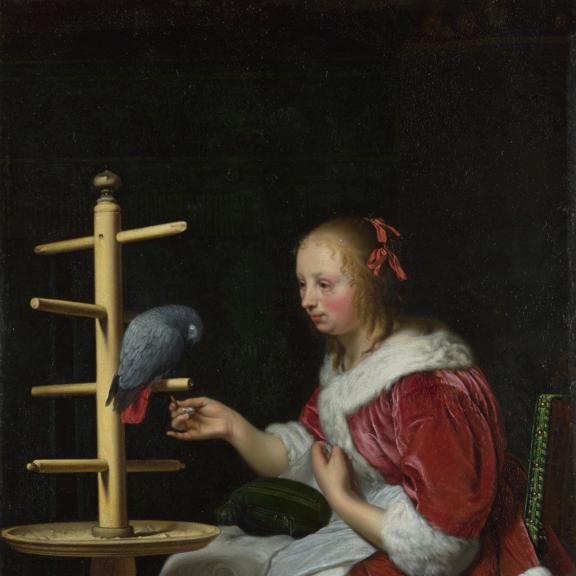 A Woman in a Red Jacket feeding a Parrot