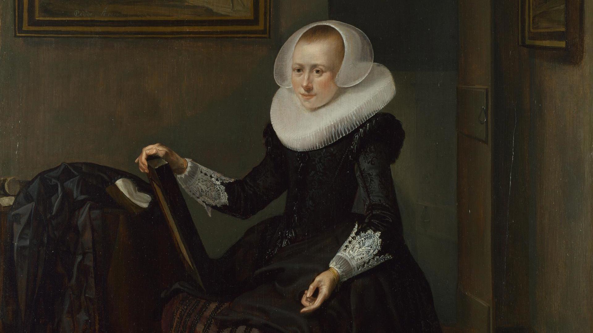 A Woman holding a Mirror by Pieter Codde