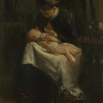 A Young Woman nursing a Baby