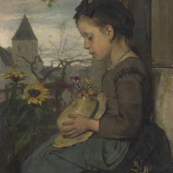 A Girl seated outside a House