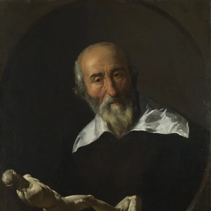 A Man holding an Armless Statuette