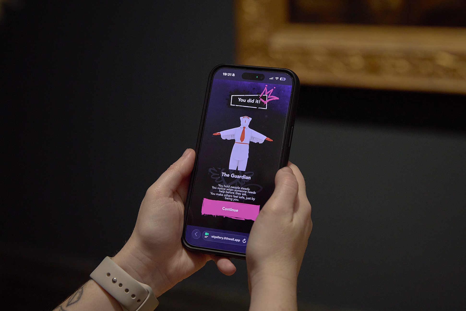 A visitor explores the National Gallery Collection using the Carreg Ateb AR experience.