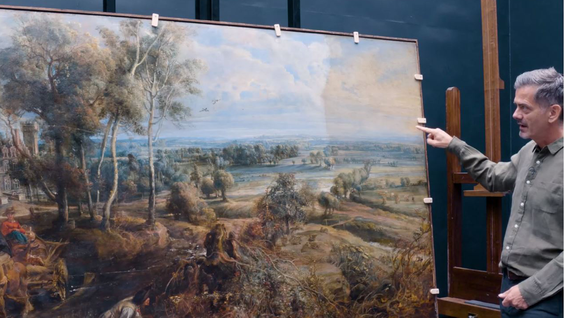 Larry showing the difference in colour where the varnish has been removed (left hand side) and still to be removed (right hand side)