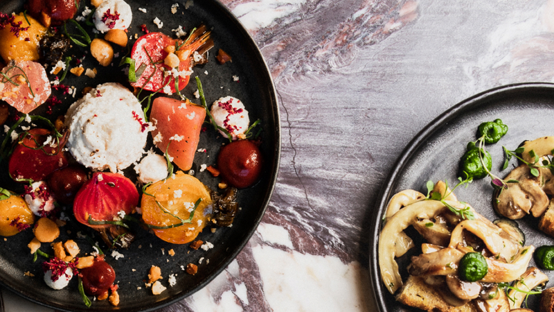 Two plates of food on a table