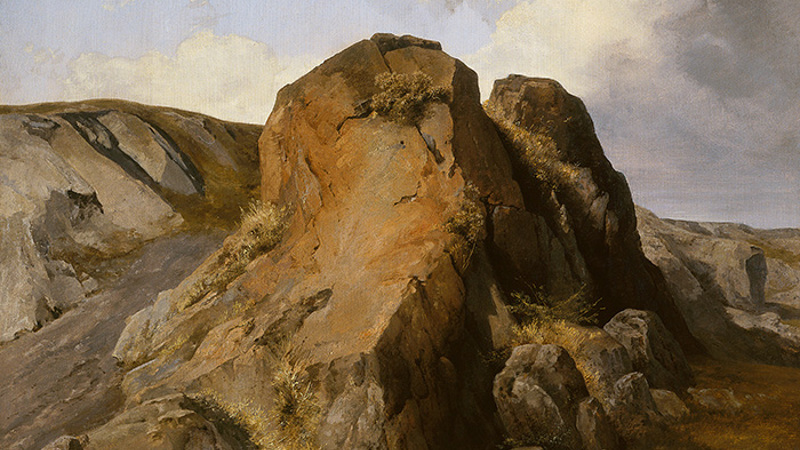 A portrait of a rock when grey clouds gather above