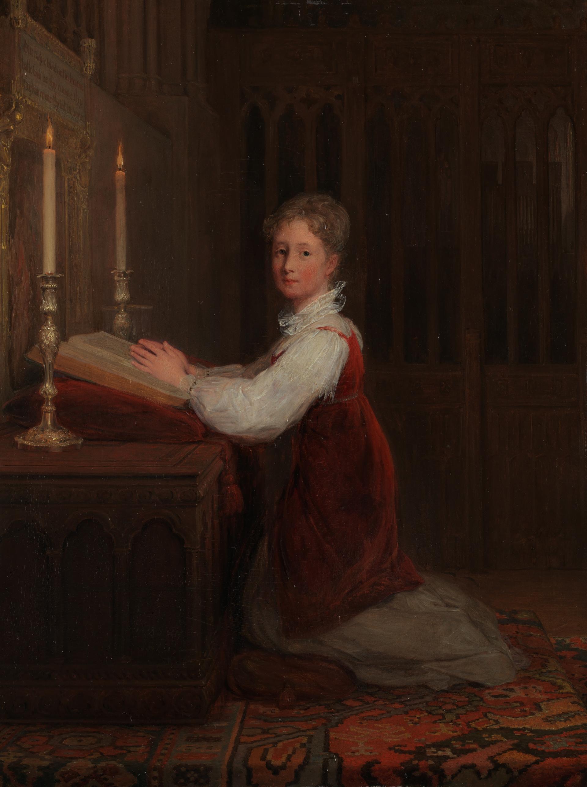 A Young Woman kneeling at a Prayer Desk