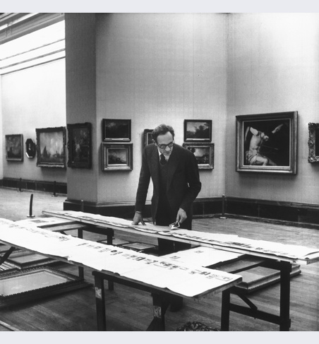 Sir Philip Hendy rehanging paintings in Duveen room, 1956.