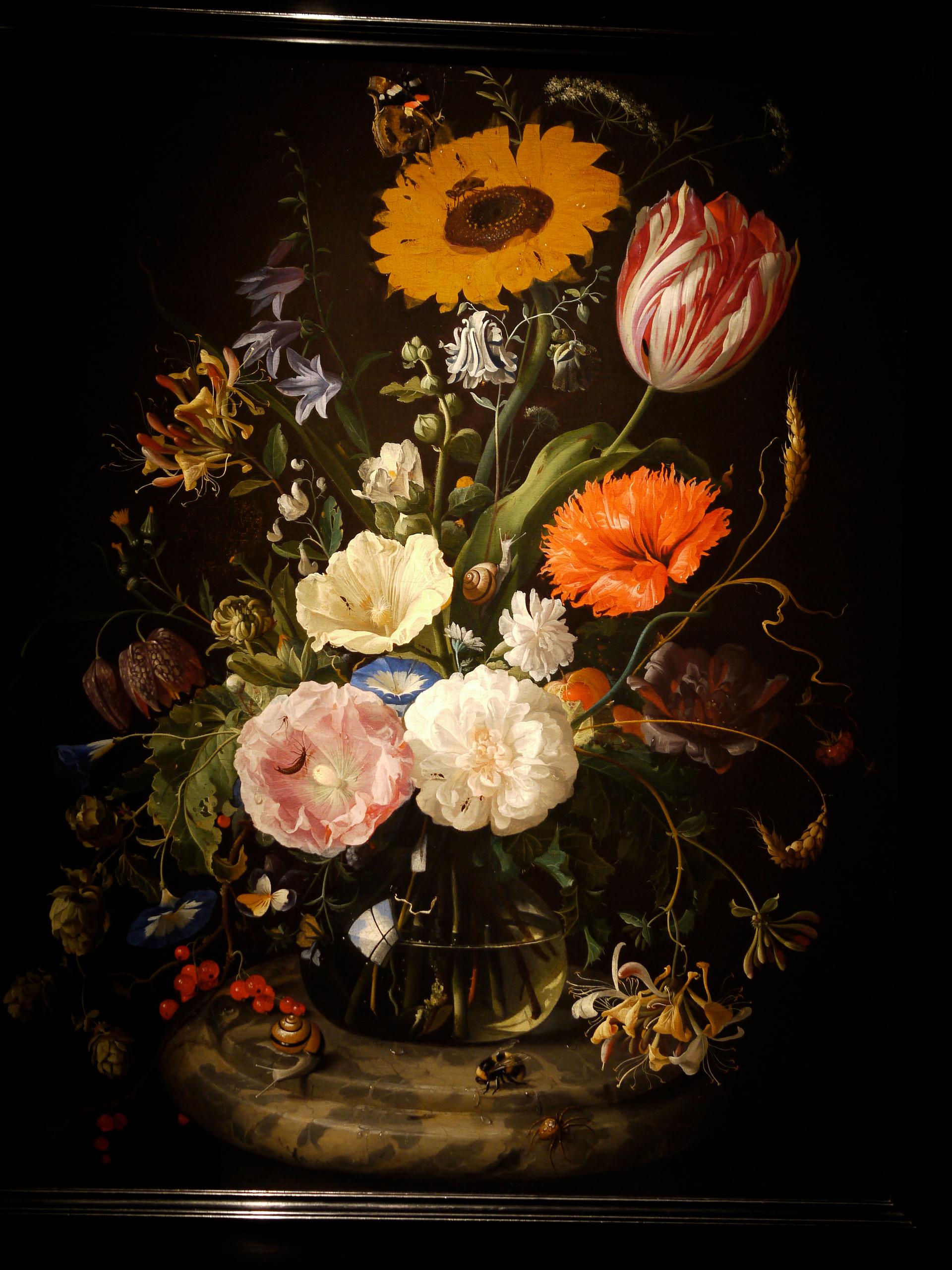 Flowers in a Glass Bottle on a Marble Plinth