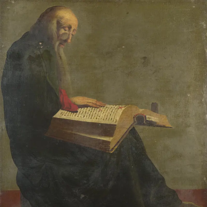 Saint Paul seated reading