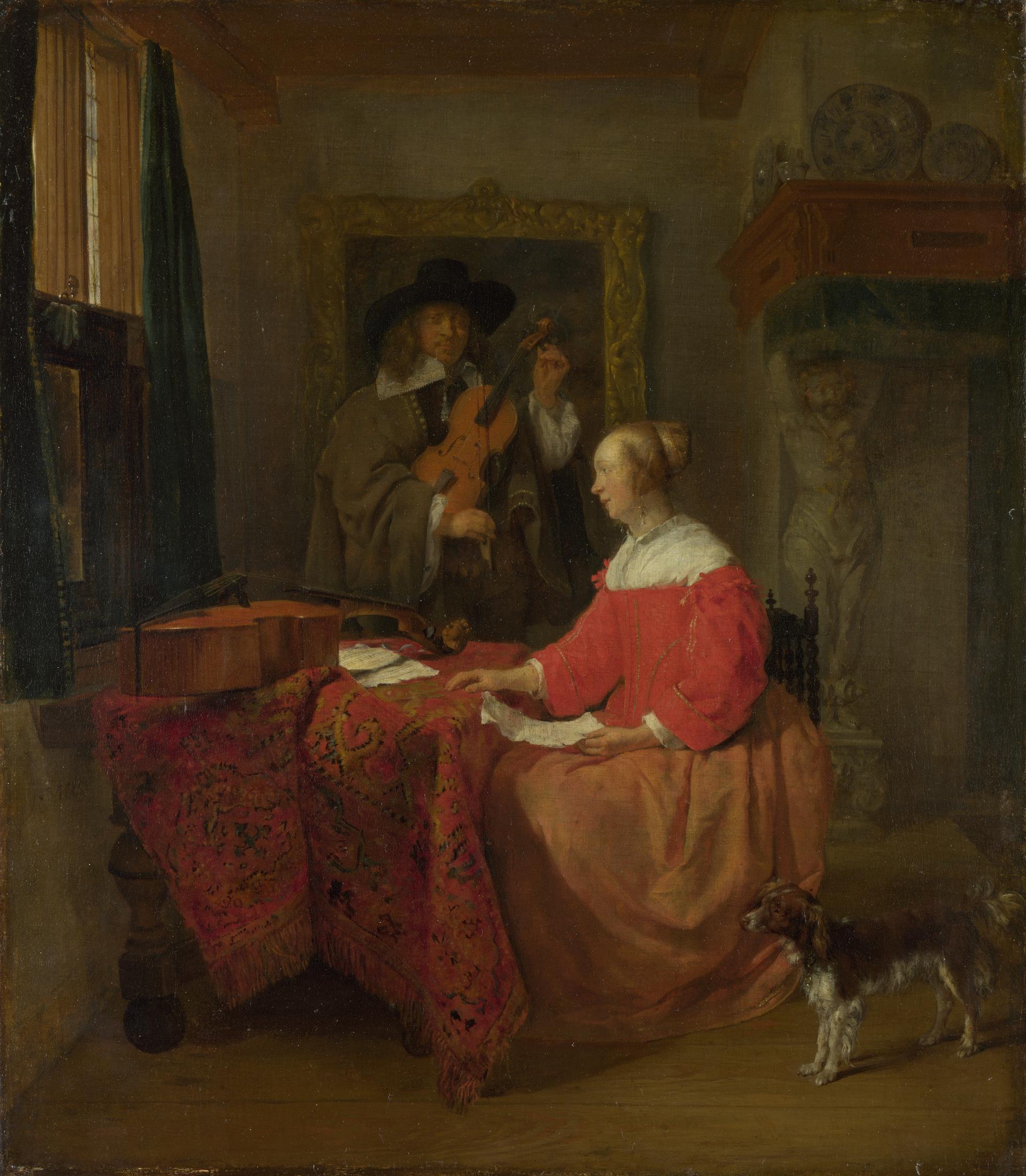 A Woman seated at a Table and a Man tuning a Violin