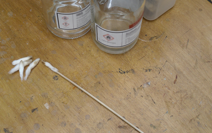 Cotton wool swabs are dipped into the chosen solvent mixture and used by the conservator to carefully remove discoloured varnish.