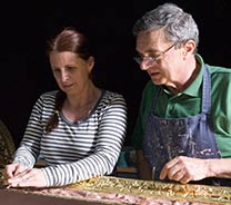 Lorenzelli and Kocum working on a frame