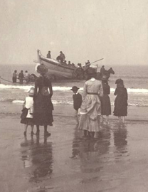 Victorian beach scene, woman and children watching boat
